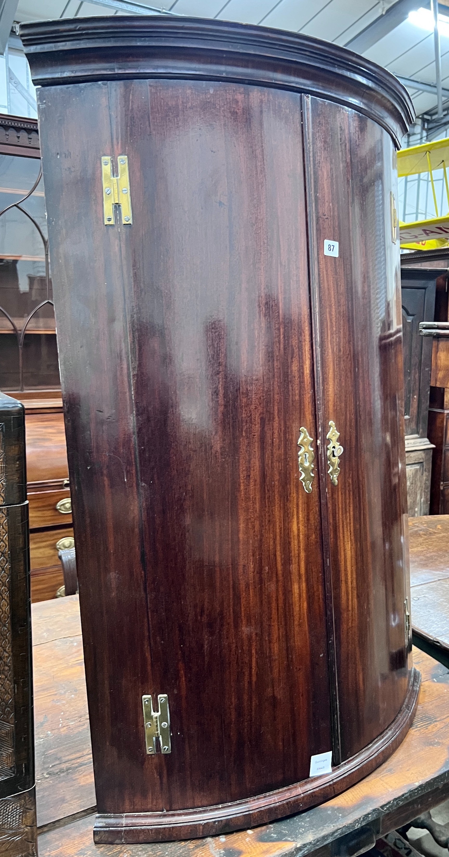 A George III mahogany bowfront hanging corner cabinet, width 73cm, depth 51cm, height 114cm *Please note the sale commences at 9am.